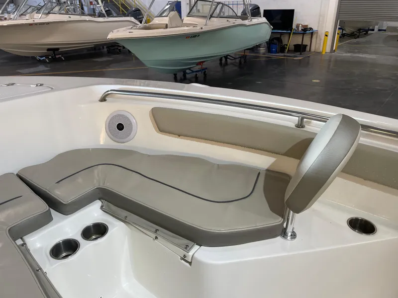 Slide: The Image of Interior of 2023 Key West 203 FS boat with cushioned seating and cup holders. - 16