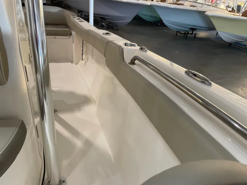 Slide: The Image of 2023 Key West 203 FS boat interior with sleek design and stainless steel railings. - 20