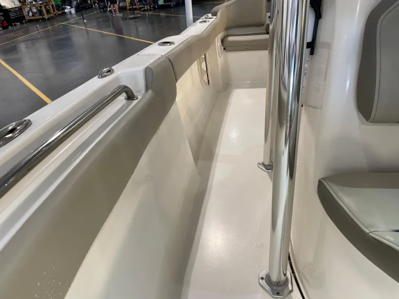 Slide: The Image of 2023 Key West 203 FS boat interior with stainless steel railings and seating. - 21