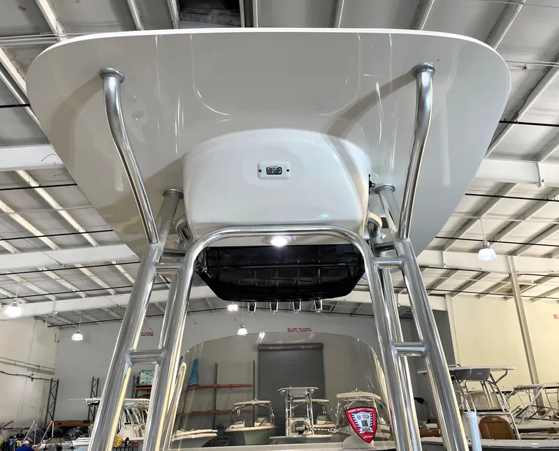 Slide: The Image of 2023 Key West 203 FS boat T-top structure in a showroom setting. - 22