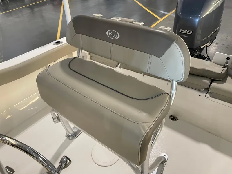 Slide: The Image of 2023 Key West 203 FS boat seat with Yamaha 150 engine in showroom. - 23