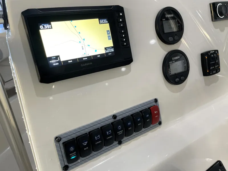 Slide: The Image of Control panel of 2023 Key West 203 FS boat with Garmin GPS and Yamaha gauges. - 25