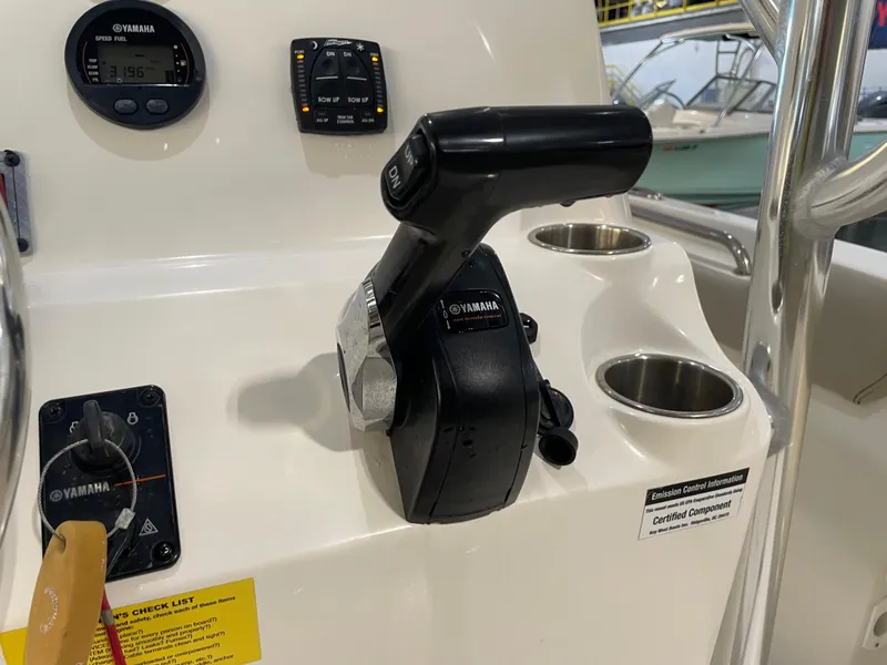 Slide: The Image of Control panel of 2023 Key West 203 FS boat with Yamaha throttle and gauges. - 27