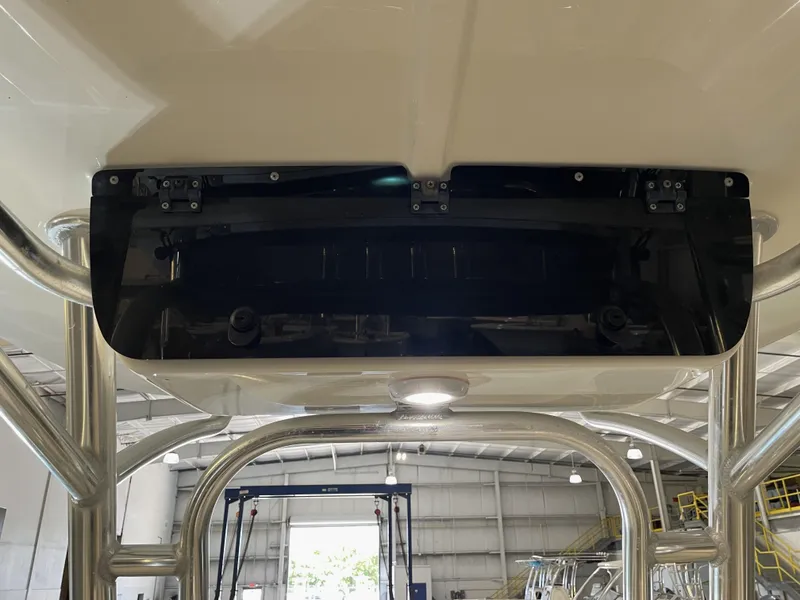 Slide: The Image of 2023 Key West 203 FS boat interior with metal framework and overhead panel. - 28