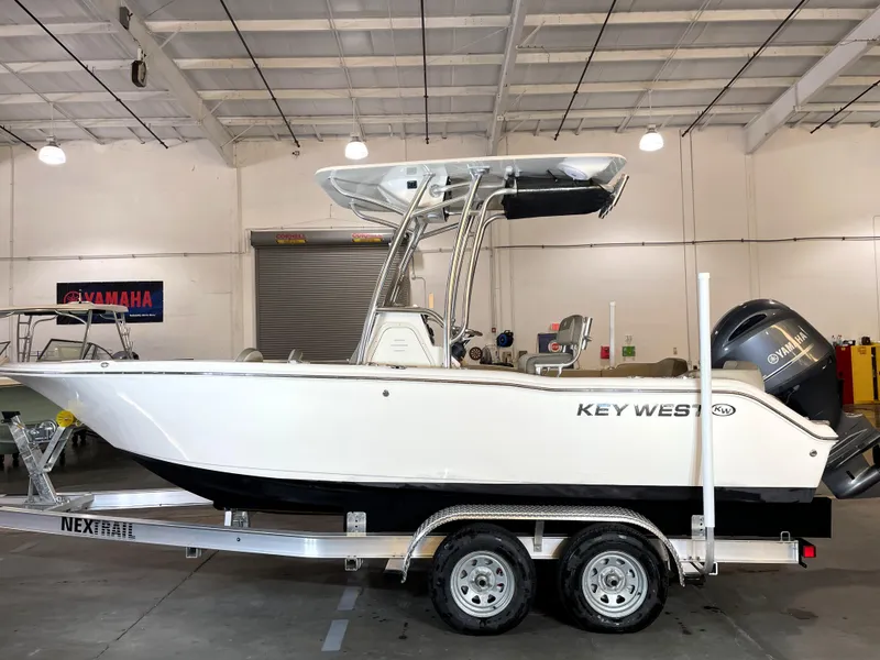 Slide: The Image of 2023 Key West 203 FS boat on trailer in indoor showroom. - 3