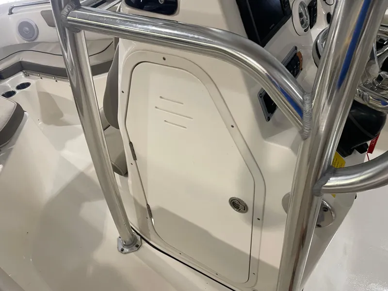 Slide: The Image of 2023 Key West 203 FS boat console with stainless steel railings and storage compartment. - 30