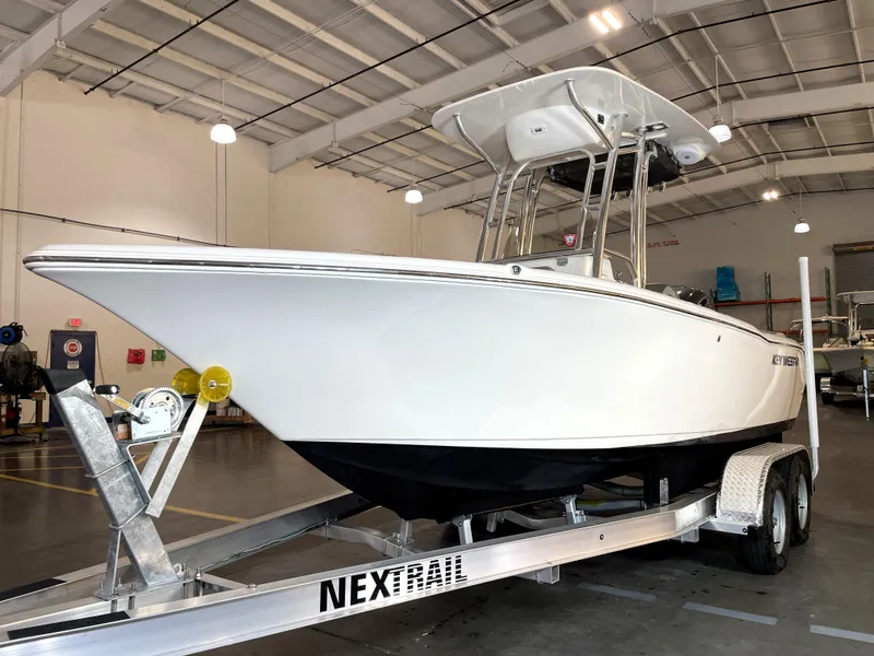 Slide: The Image of 2023 Key West 203 FS boat on trailer in indoor showroom. - 4