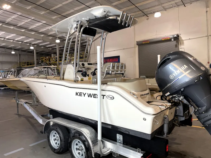 Slide: The Image of 2023 Key West 203 FS boat with Yamaha engine in a showroom. - 5