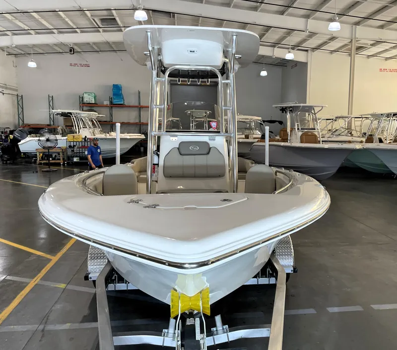 Slide: The Image of 2023 Key West 203 FS boat in showroom, front view, on trailer. - 6