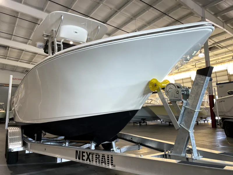 Slide: The Image of 2023 Key West 203 FS boat on trailer in indoor showroom. - 8