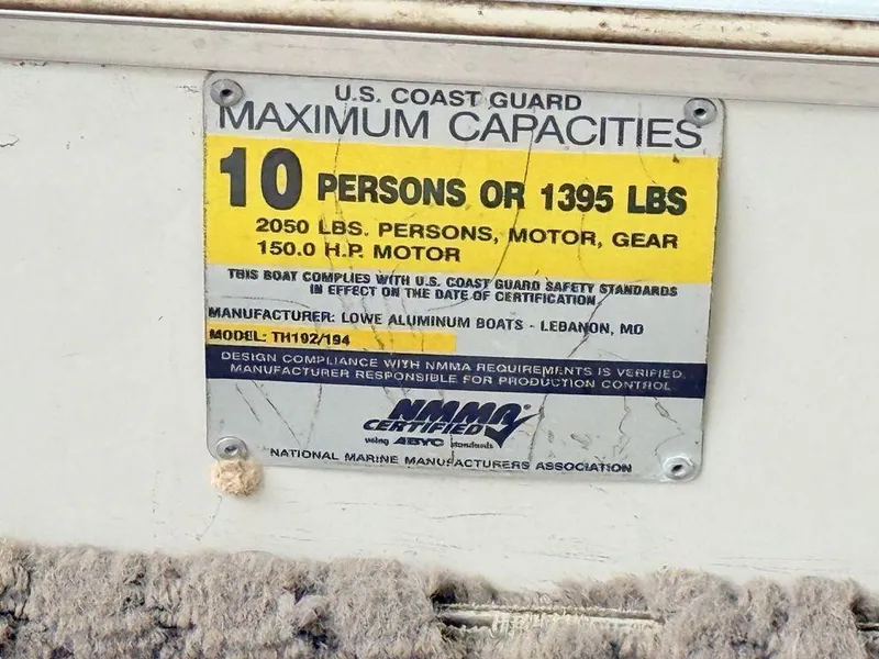 Slide: The Image of 2005 Lowe Suncruiser capacity plate: 10 persons or 1395 lbs, 150 HP motor. - 16