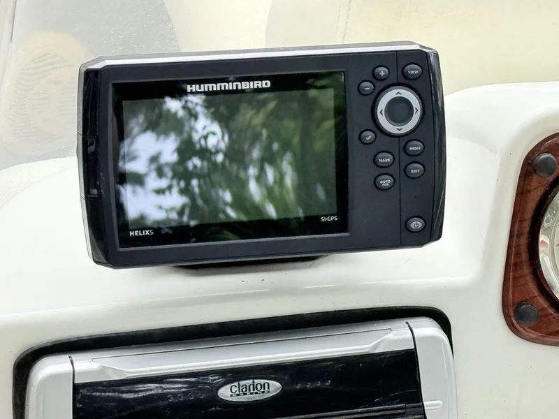 Slide: The Image of Humminbird Helix 5 GPS on 2005 Lowe Suncruiser boat dashboard. - 8