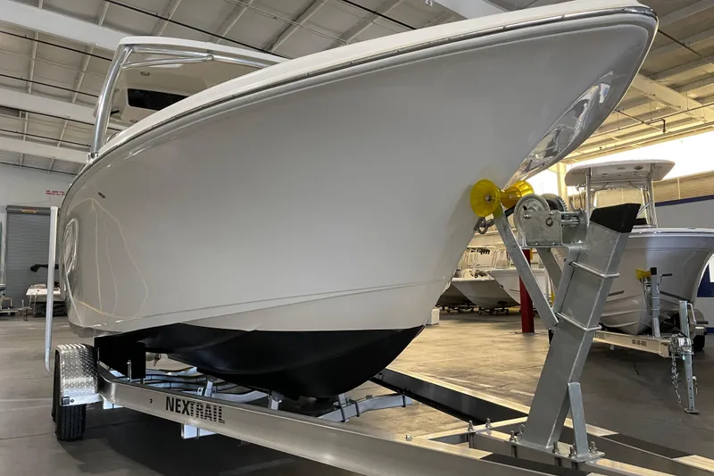 Slide: The Image of 2023 Key West 239 DFS boat with Yamaha 250 engine in a showroom. - 10