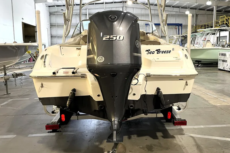 Slide: The Image of 2023 Key West 239 DFS boat with Yamaha outboard motor and swim ladder. - 11