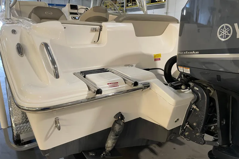 Slide: The Image of 2023 Key West 239 DFS boat, rear view, featuring "Sea Breeze II" name. - 12