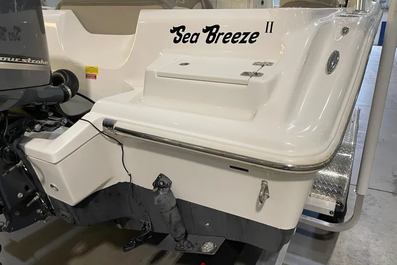 Slide: The Image of 2023 Key West 239 DFS boat with Yamaha outboard motor in a showroom. - 13