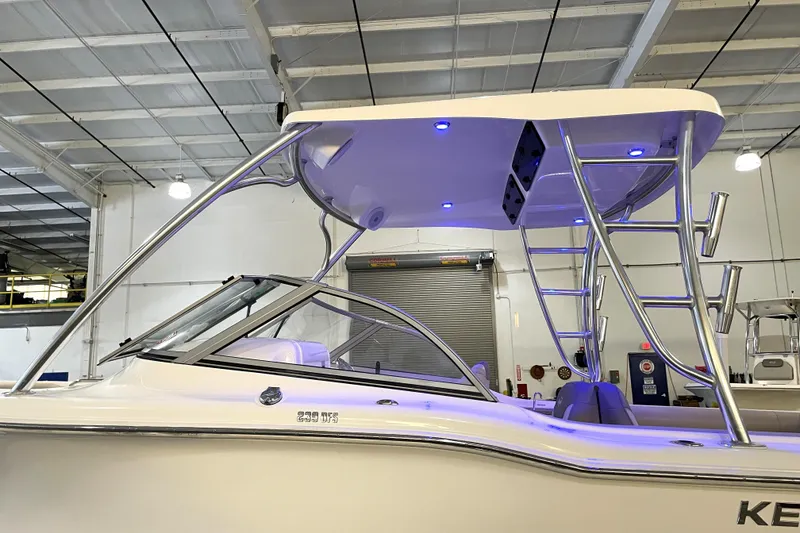 Slide: The Image of 2023 Key West 239 DFS boat logo in a showroom setting. - 18