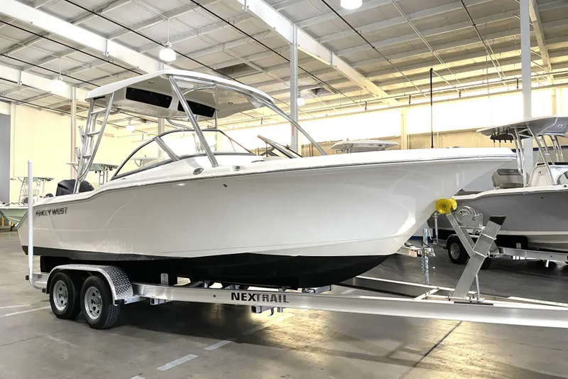 Slide: The Image of 2023 Key West 239 DFS boat on trailer in indoor showroom. - 2