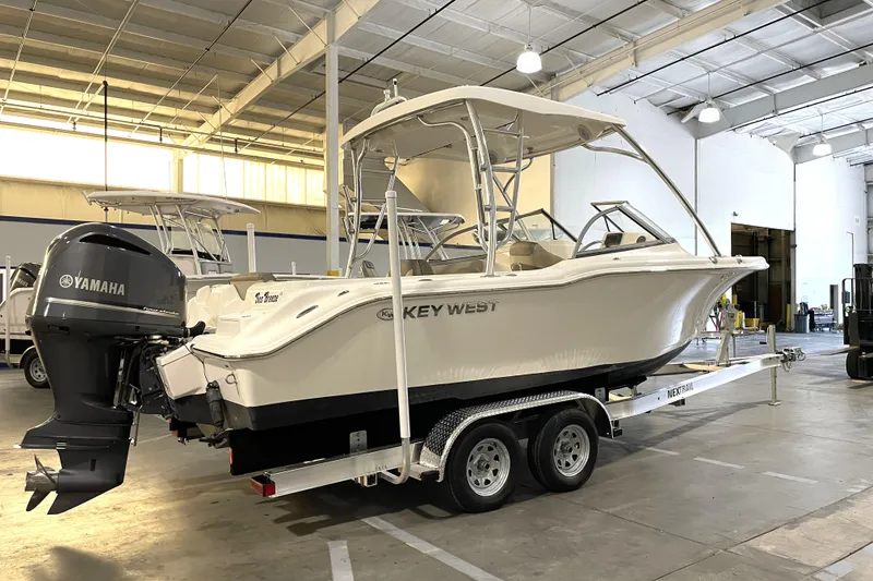 Slide: The Image of 2023 Key West 239 DFS boat on trailer in indoor showroom. - 3