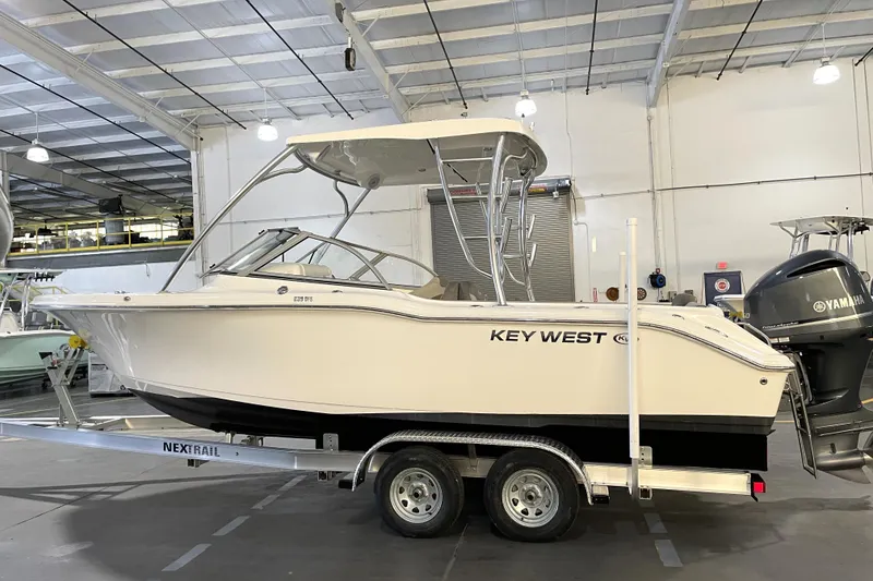 Slide: The Image of 2023 Key West 239 DFS boat on trailer in indoor storage facility. - 4
