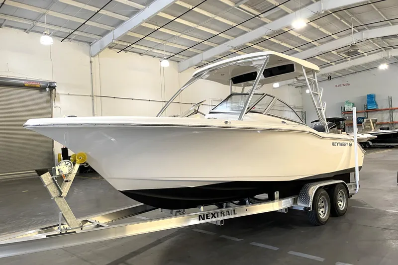 Slide: The Image of 2023 Key West 239 DFS boat with Yamaha engine on trailer in warehouse. - 5
