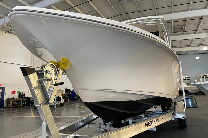 Slide: The Image of 2023 Key West 239 DFS boat on trailer in showroom. - 9