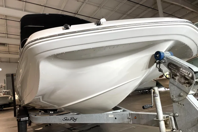 Slide: The Image of 2022 Hurricane SunDeck Sport 201 OB boat on trailer, viewed from the front. - 10