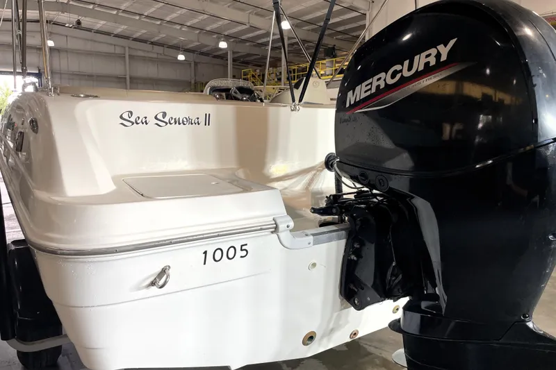 Slide: The Image of 2022 Hurricane SunDeck Sport 201 OB boat interior with seating and cup holders. - 13