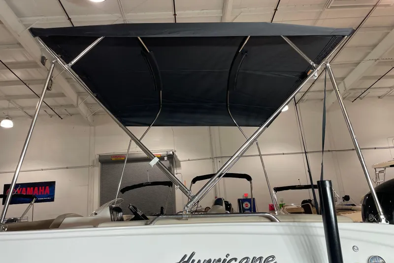 Slide: The Image of 2022 Hurricane SunDeck Sport 201 OB boat seating with cup holders, beige upholstery. - 17