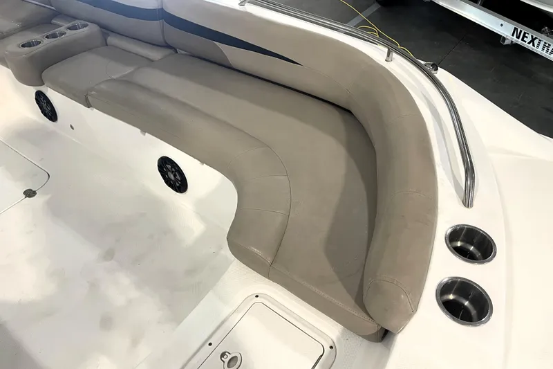 Slide: The Image of 2022 Hurricane SunDeck Sport 201 OB boat interior with beige seating and steering area. - 20