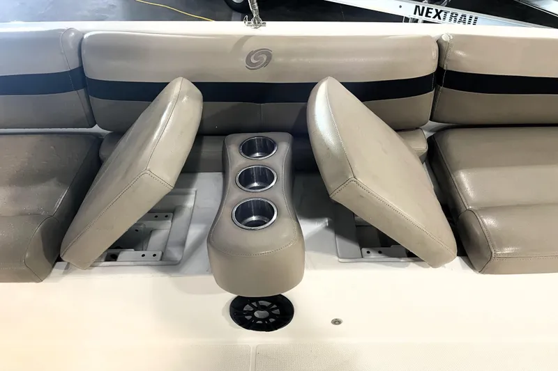 Slide: The Image of 2022 Hurricane SunDeck Sport 201 OB boat dashboard with steering wheel and controls. - 21