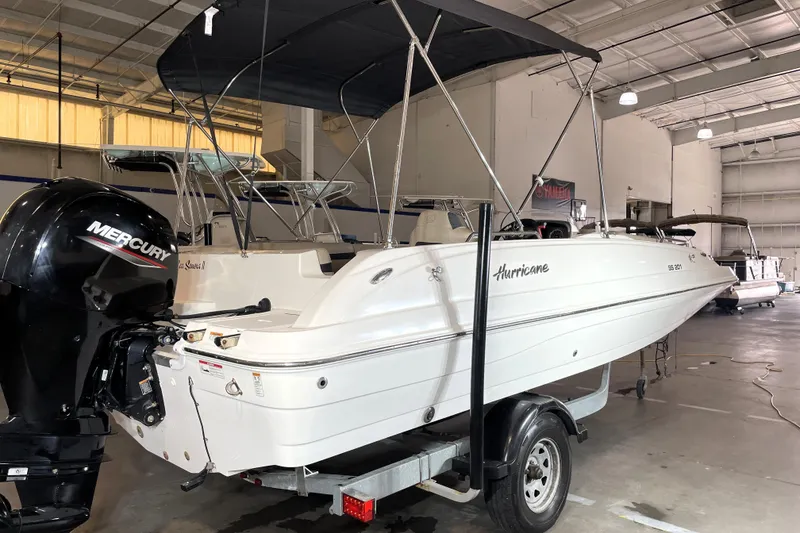 Slide: The Image of 2022 Hurricane SunDeck Sport 201 OB boat with spacious seating and sleek design. - 7
