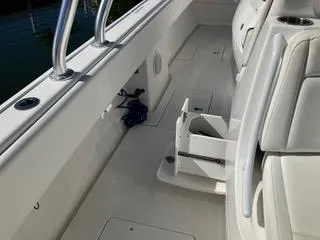 Slide: The Image of 2016 Intrepid 400 Center Console boat interior with white seating and deck. - 24
