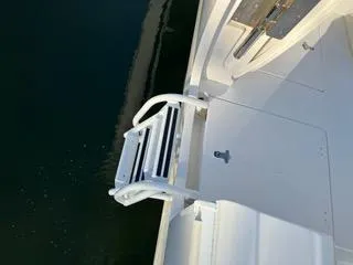 Slide: The Image of 2016 Intrepid 400 Center Console boat with a foldable swim ladder. - 3