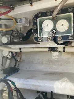 Slide: The Image of Engine compartment of a 2016 Intrepid 400 Center Console boat, showing wiring and components. - 31