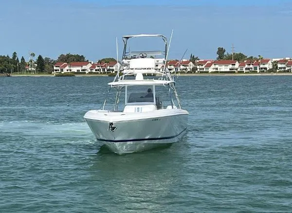 Slide: The Image of 2016 Intrepid 400 Center Console boat cruising on a calm waterway. - 32