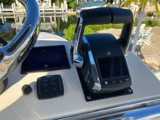 Slide: The Image of Control panel of a 2016 Intrepid 400 Center Console boat, featuring throttle and display. - 9