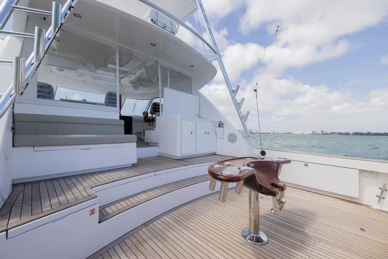 Slide: The Image of 2022 Bertram 50 yacht deck with seating and ocean view. - 13