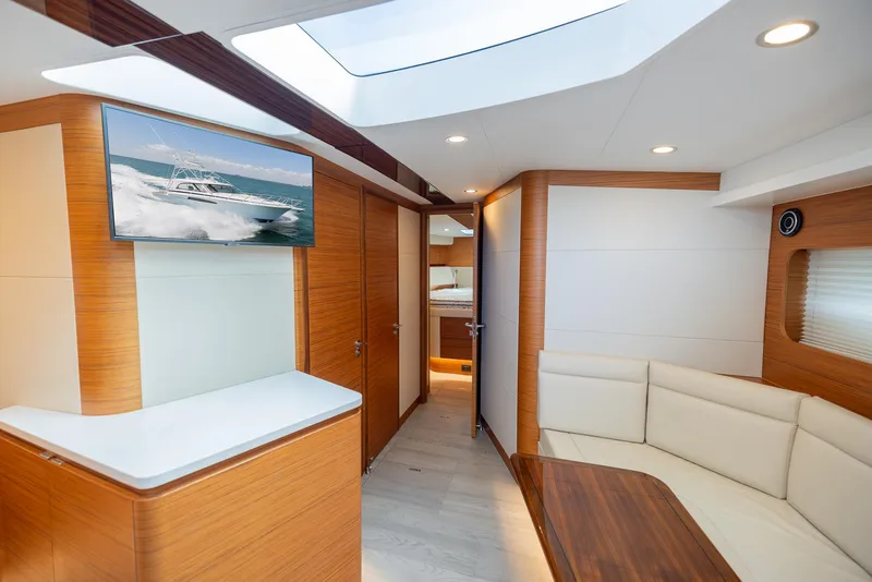 Slide: The Image of Luxurious interior of a 2022 Bertram 50 yacht with modern furnishings and skylight. - 21
