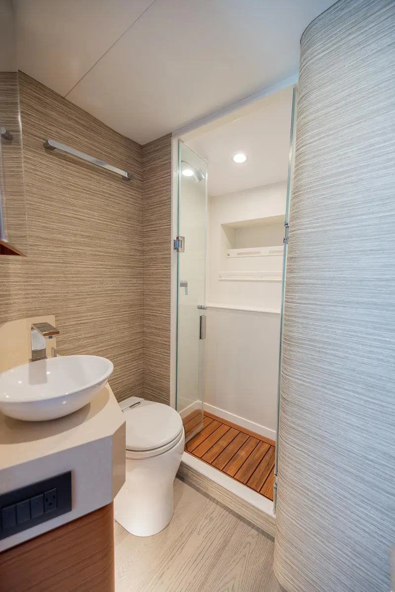Slide: The Image of Modern bathroom on 2022 Bertram 50 yacht with shower and vessel sink. - 28