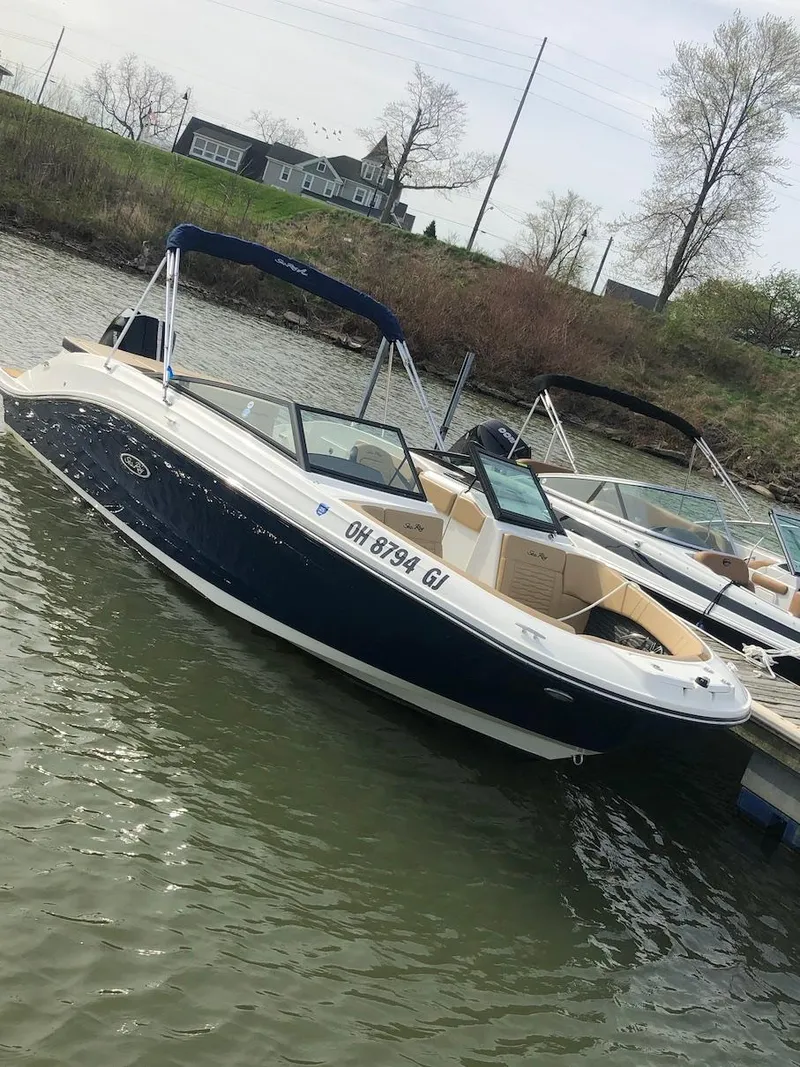 Slide: The Image of 2022 Sea Ray SPX 230 OB boat docked on a calm lake. - 5