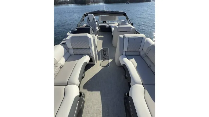 Slide: The Image of 2025 Tahoe Pontoon Cascade Cruise Rear Bench on water, featuring spacious seating and elegant design. - 10