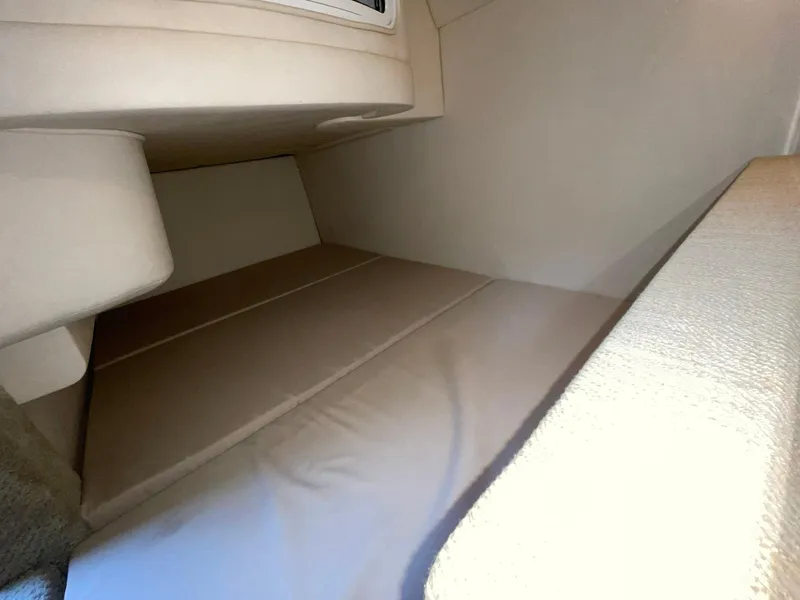 Slide: The Image of 2008 Sea Ray 280 Sundancer cabin interior with beige upholstery. - 29