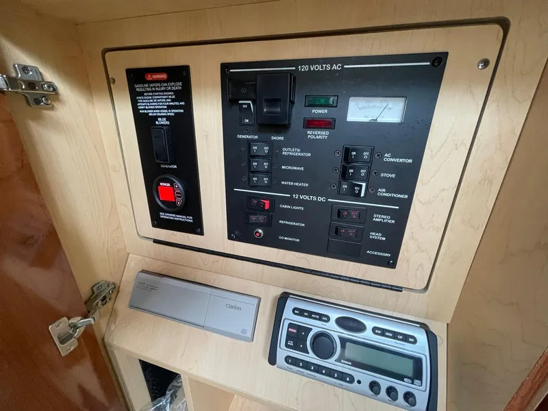 Slide: The Image of Electrical control panel inside 2008 Sea Ray 280 Sundancer boat cabin. - 33