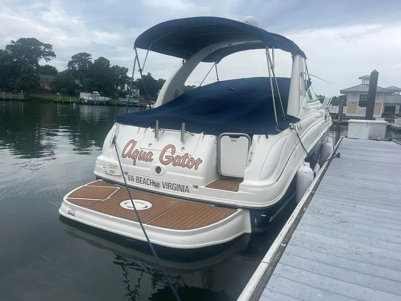 Slide: The Image of 2008 Sea Ray 280 Sundancer docked, named "Aqua Gator," in Virginia Beach marina. - 38