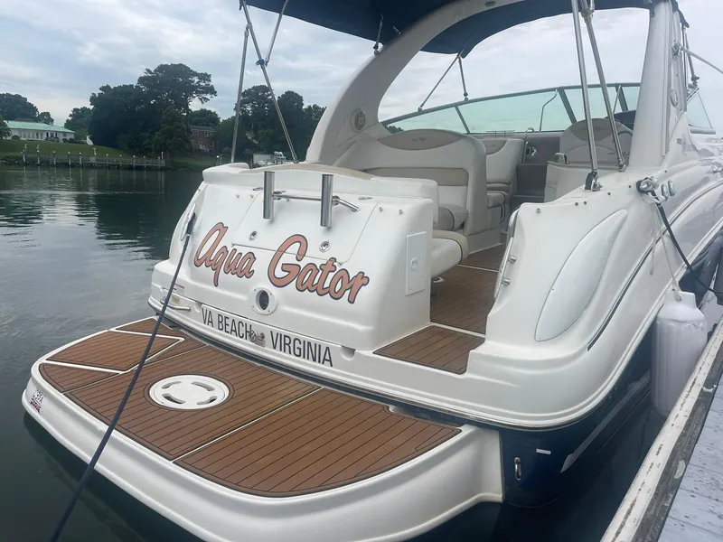 Slide: The Image of 2008 Sea Ray 280 Sundancer boat docked, named "Aqua Gator," in Virginia Beach. - 40
