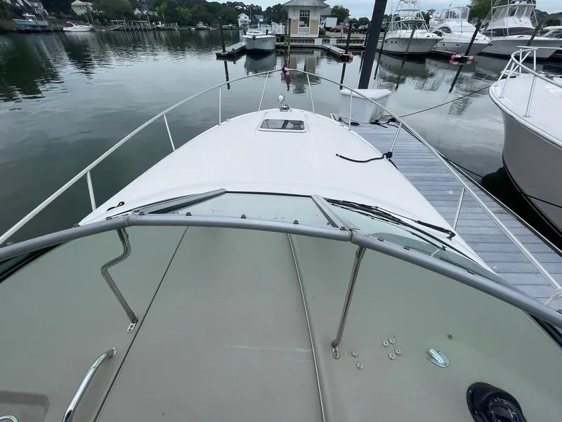 Slide: The Image of 2008 Sea Ray 280 Sundancer docked at marina, view from bow. - 8