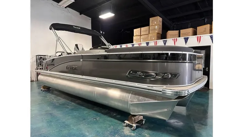 The Image of 2025 Tahoe Pontoon Cascade Cruise Rear Bench in showroom, sleek design, metallic finish. - 20