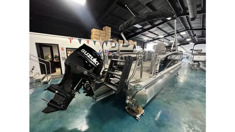 Slide: The Image of 2025 Tahoe Pontoon Cascade Cruise Rear Bench with Suzuki engine in showroom. - 28