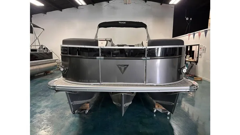 Slide: The Image of 2025 Tahoe Pontoon Cascade Cruise Rear Bench in showroom, rear view. - 30
